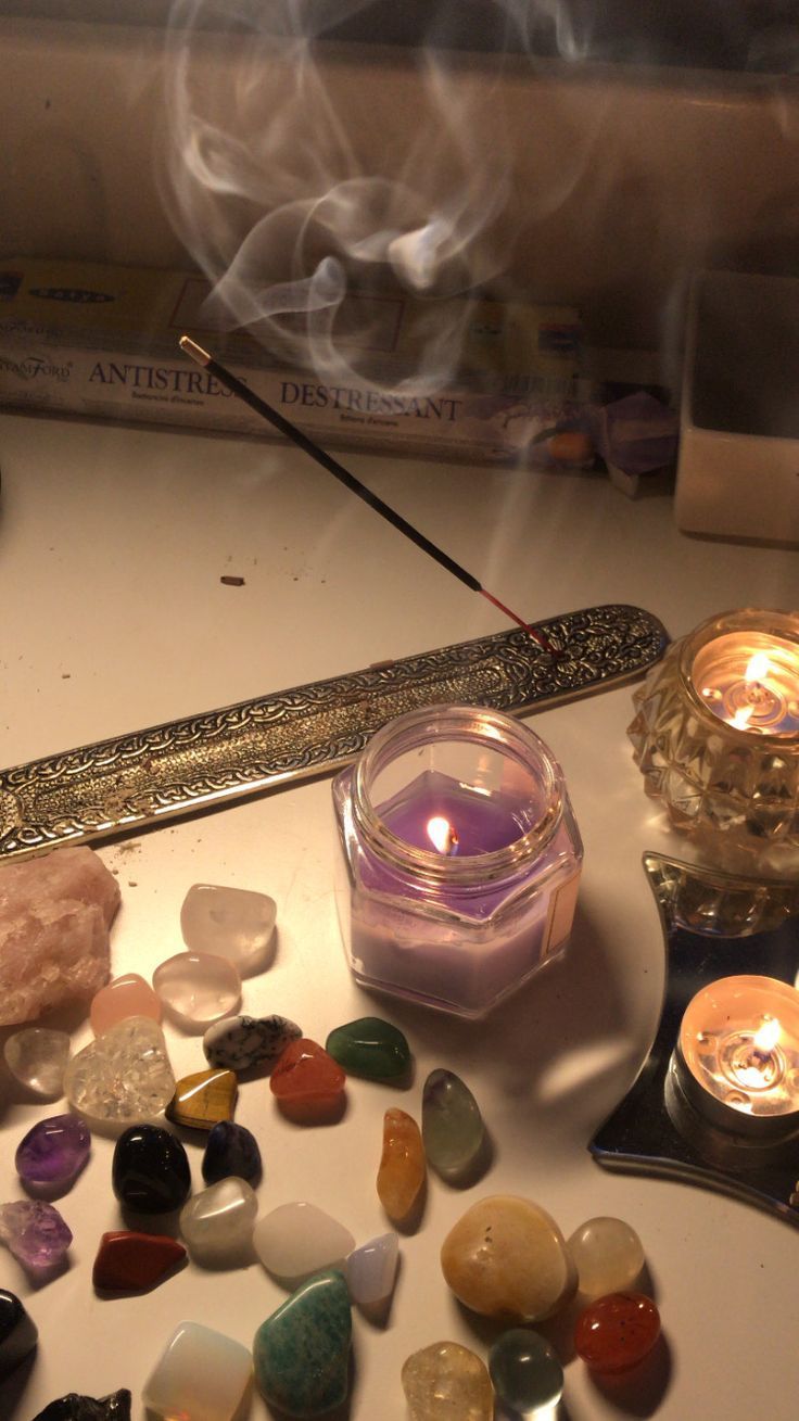 candles and colored stones on the table