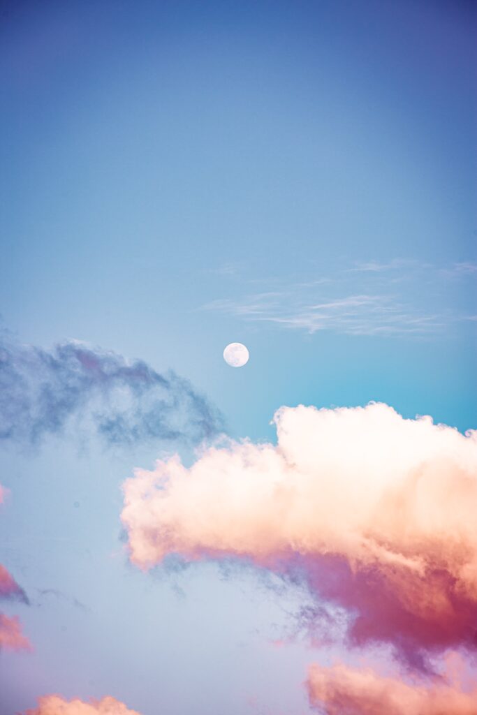 Sky with pink clouds and the moon